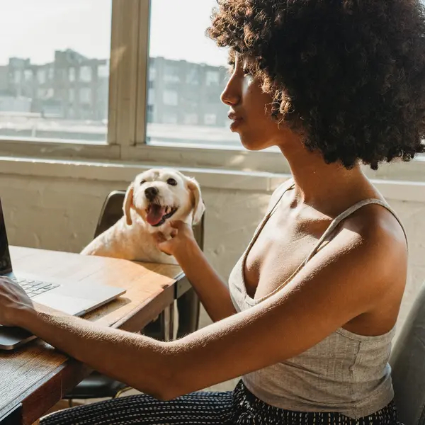 Women working from home with her dog